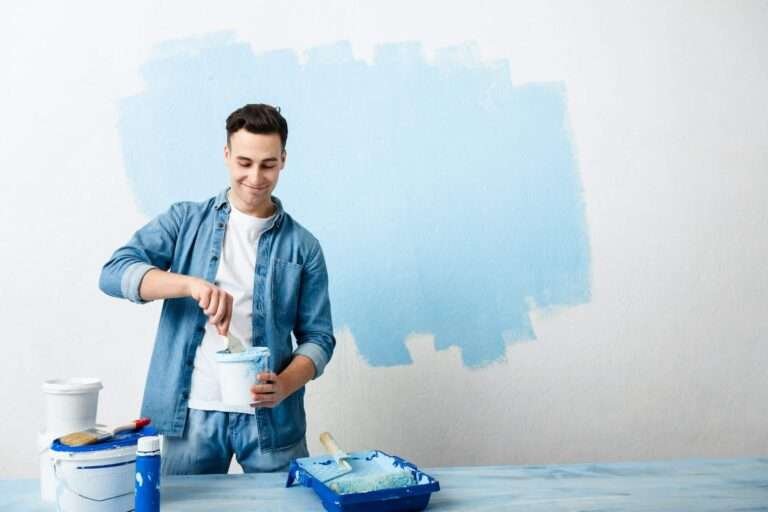 happy-guy-mixes-pigment-for-paint-wall